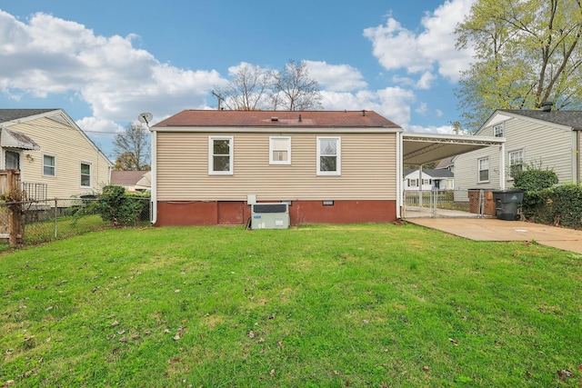 back of house with a yard and fence