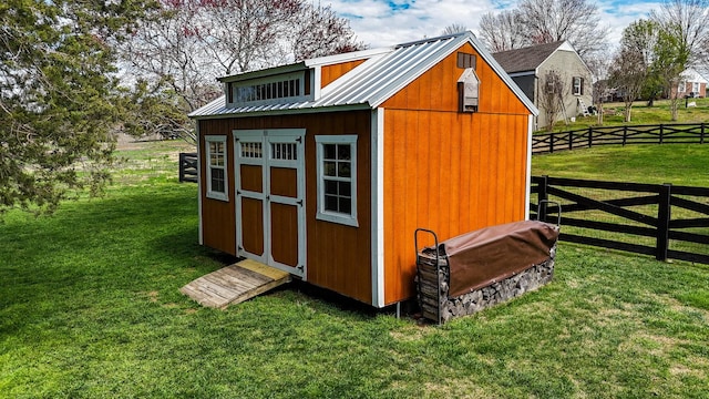 view of shed with fence