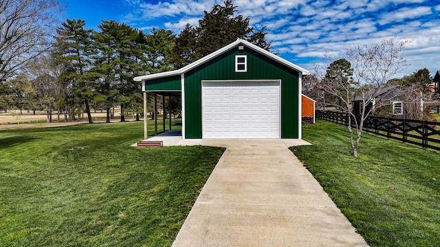detached garage featuring fence