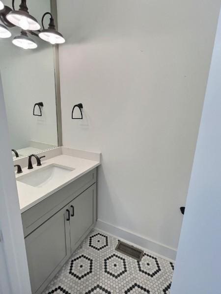 1412 Woodmont Blvd, Nashville, TN 37215 - bathroom with baseboards, visible vents, tile patterned flooring, and vanity