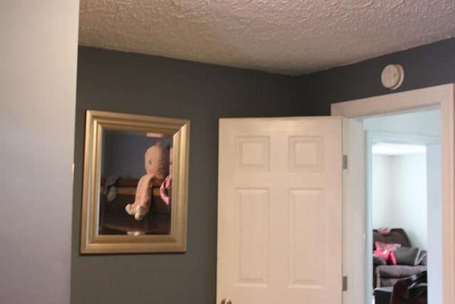 interior space with a textured ceiling