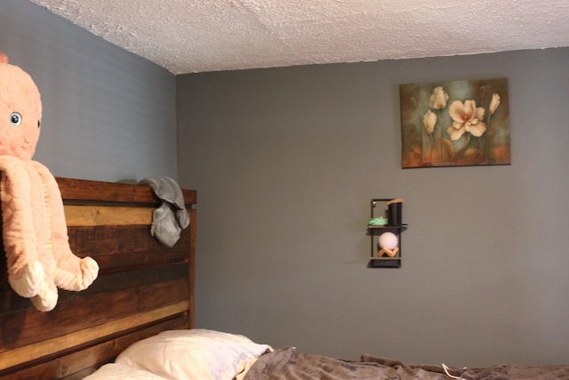 bedroom featuring a textured ceiling