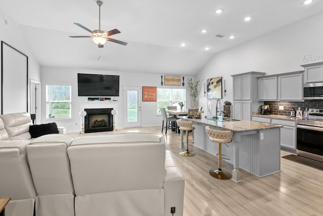 3652 Stormy Ln, Rockvale, TN 37153 - living area with plenty of natural light, lofted ceiling, light wood-style floors, and a ceiling fan