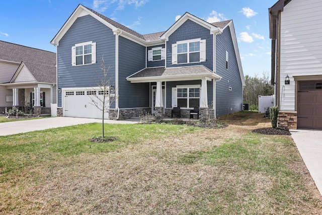 3652 Stormy Ln, Rockvale, TN 37153 - view of front of home with an attached garage, stone siding, driveway, a front lawn, and covered porch