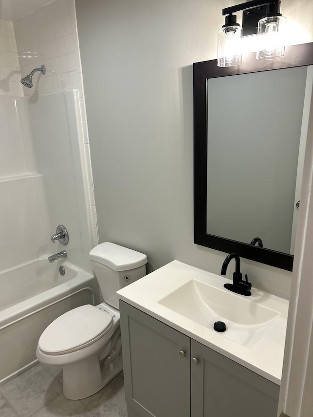 bathroom with shower / bathing tub combination, toilet, and vanity