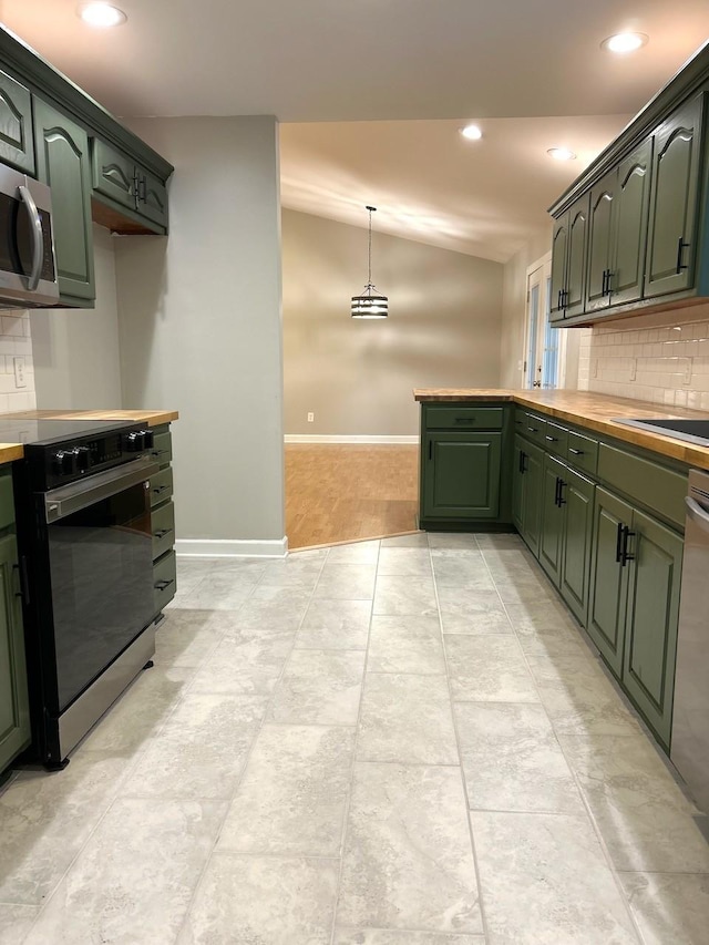 kitchen with baseboards, stainless steel appliances, backsplash, and green cabinetry