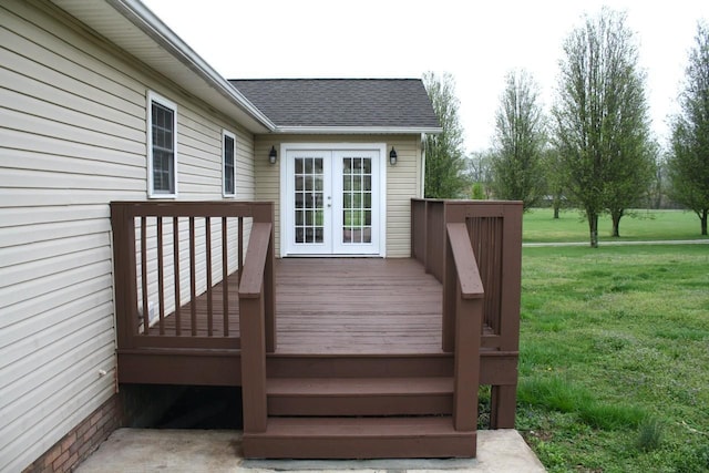wooden terrace with french doors and a yard