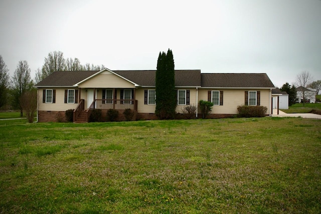 ranch-style home featuring covered porch, a front lawn, and crawl space