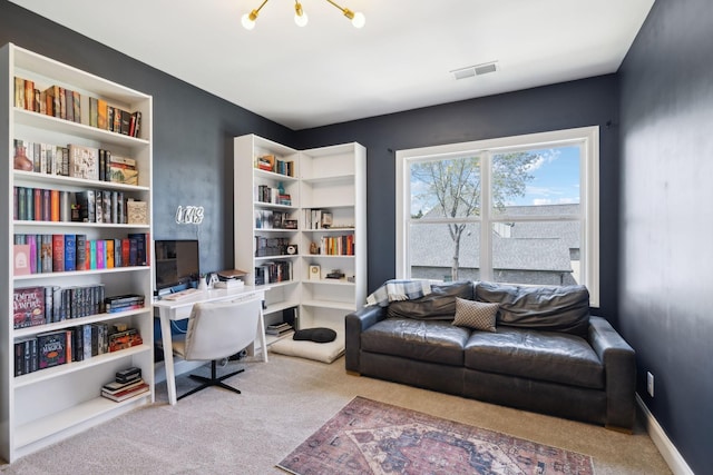 carpeted office featuring baseboards and visible vents