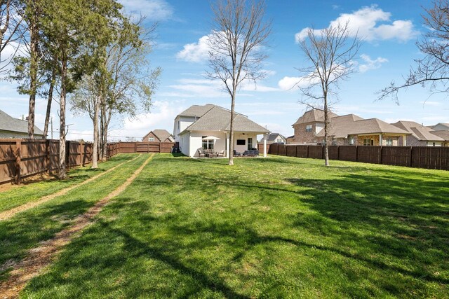 view of yard featuring a fenced backyard