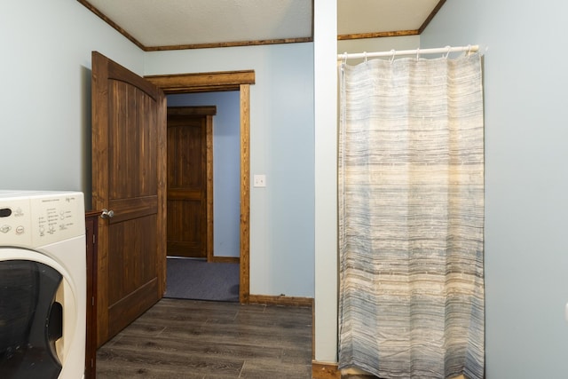 washroom with dark wood-style flooring, washer / clothes dryer, laundry area, and crown molding