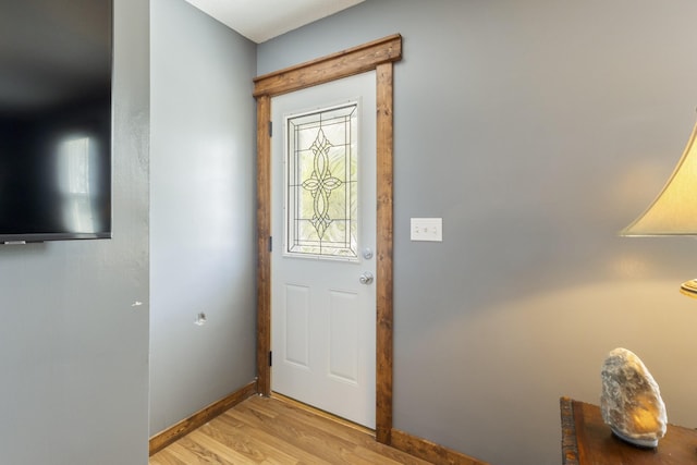 entrance foyer featuring light wood-style floors and baseboards