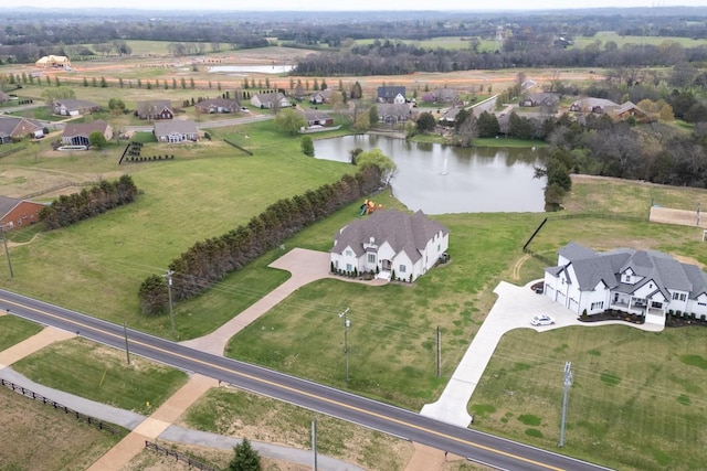 aerial view with a water view and a rural view