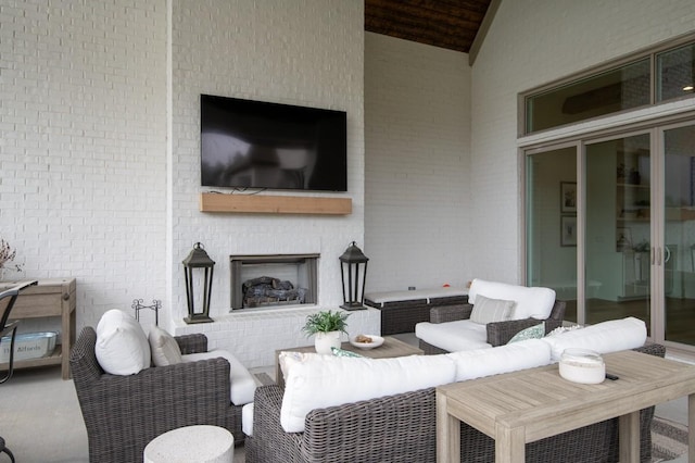 exterior space with an outdoor living space with a fireplace