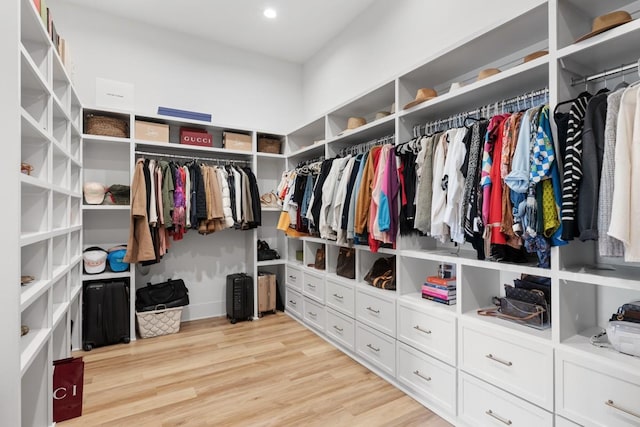 walk in closet featuring light wood-style flooring