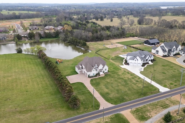 aerial view with a residential view, a water view, and a rural view