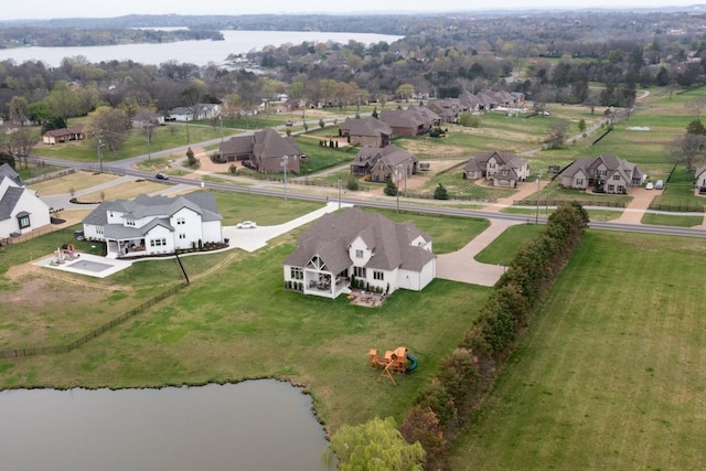 bird's eye view with a residential view and a water view