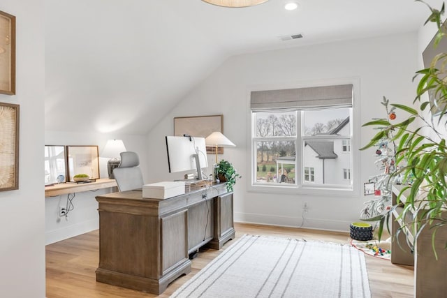 home office with lofted ceiling, light wood-type flooring, recessed lighting, baseboards, and visible vents