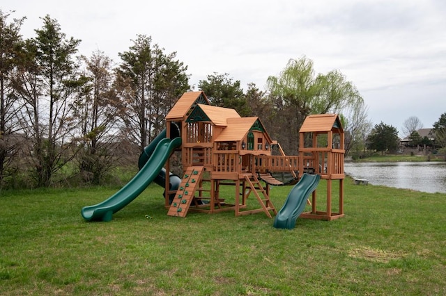 view of jungle gym featuring a water view and a yard