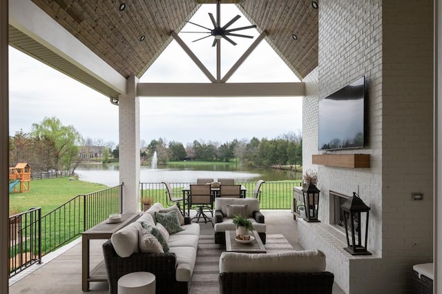 view of patio / terrace with outdoor lounge area, a gazebo, a water view, and a playground