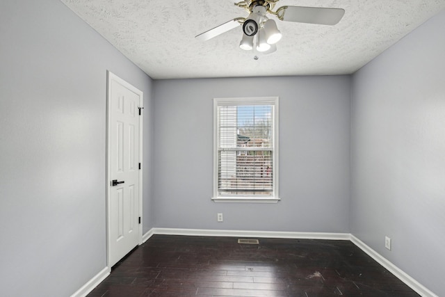 empty room featuring baseboards, a textured ceiling, a ceiling fan, and hardwood / wood-style flooring