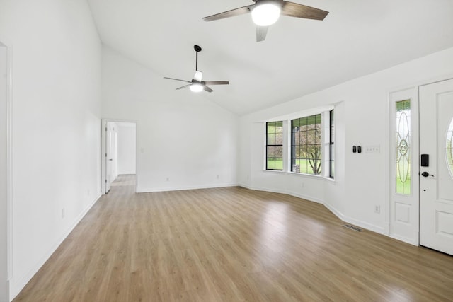 entryway with baseboards, visible vents, light wood-type flooring, and a ceiling fan