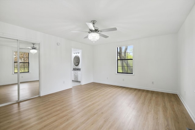 interior space featuring a healthy amount of sunlight, light wood-style flooring, and a ceiling fan
