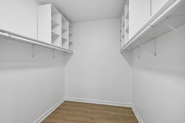 spacious closet with wood finished floors