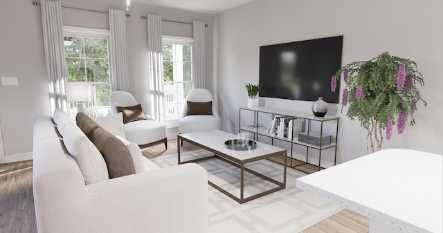 living area with baseboards and wood finished floors