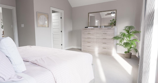 bedroom with carpet flooring and lofted ceiling