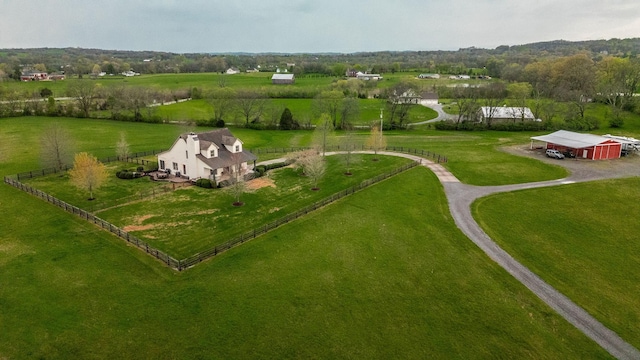 birds eye view of property with a rural view