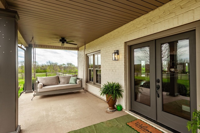 view of patio / terrace featuring french doors and a ceiling fan