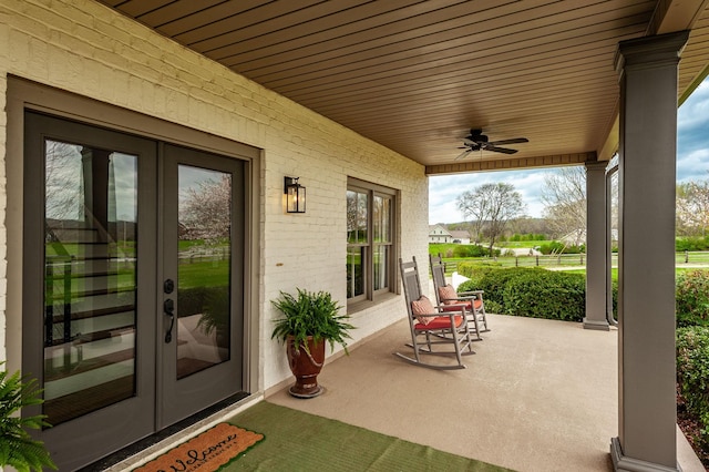 view of patio / terrace featuring french doors, a ceiling fan, and a porch