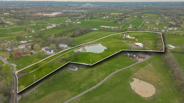 bird's eye view featuring a water view and a rural view