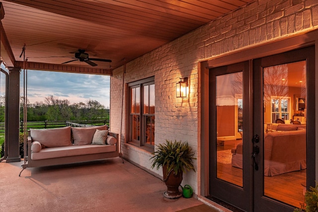 patio terrace at dusk with ceiling fan