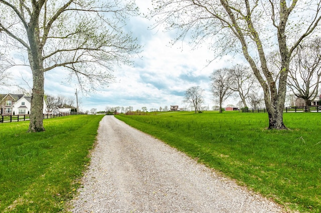 view of road with gravel driveway