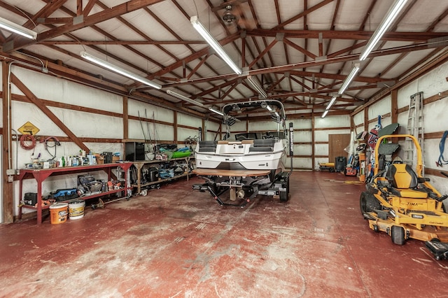 garage featuring metal wall and a workshop area