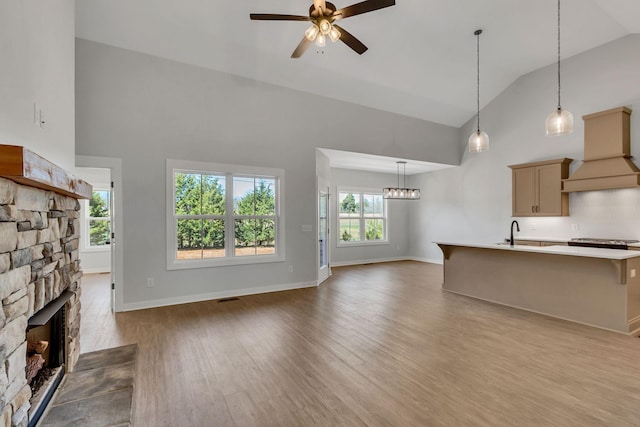 198 Creekside Dr, Lewisburg, TN 37091 - unfurnished living room with high vaulted ceiling, dark wood finished floors, ceiling fan, visible vents, and a fireplace