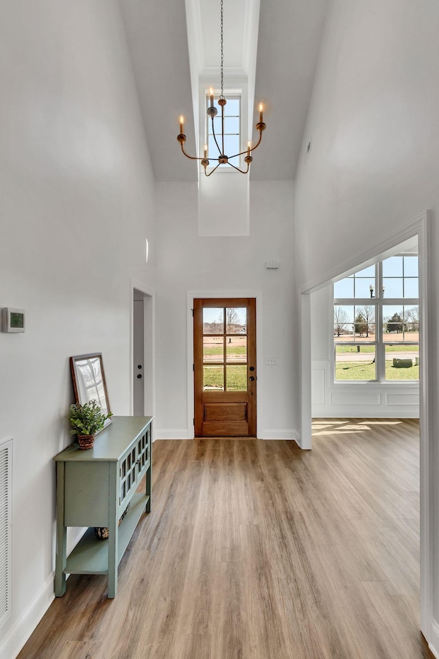 200 Creekside Dr, Lewisburg, TN 37091 - entryway featuring baseboards, light wood-style floors, and an inviting chandelier