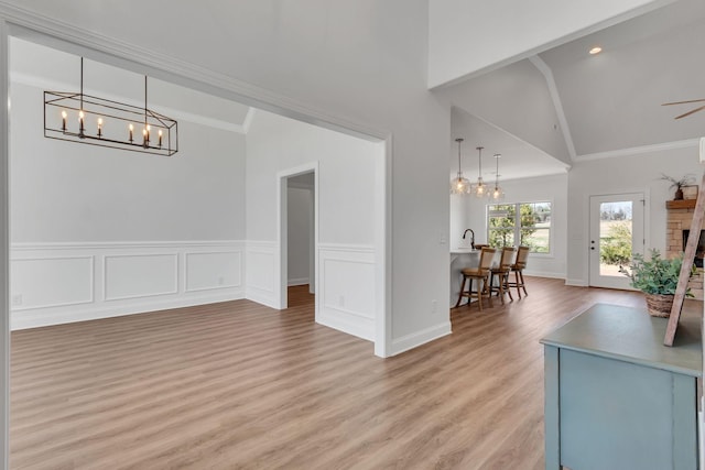 200 Creekside Dr, Lewisburg, TN 37091 - dining space featuring ceiling fan with notable chandelier, lofted ceiling, crown molding, and light wood-style floors