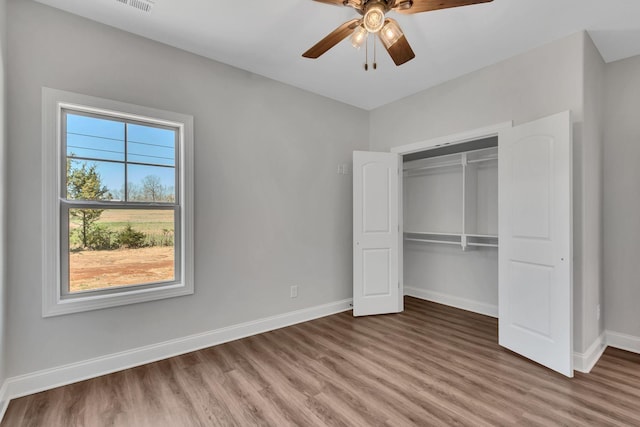 200 Creekside Dr, Lewisburg, TN 37091 - unfurnished bedroom featuring a ceiling fan, a closet, baseboards, and wood finished floors