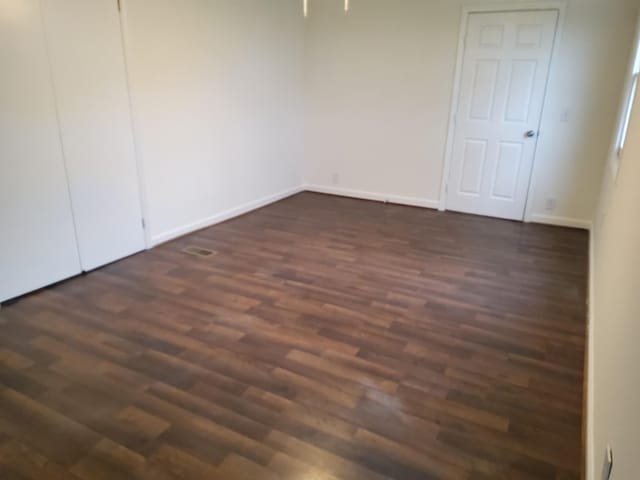 1833 Porterfield Rd, Readyville, TN 37149 - unfurnished bedroom with dark wood-type flooring and baseboards