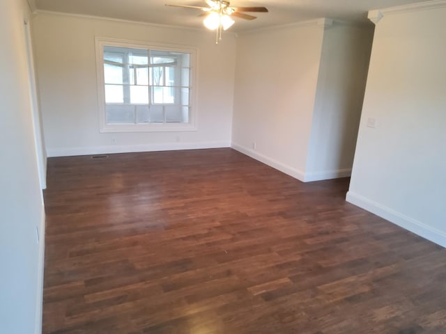 1833 Porterfield Rd, Readyville, TN 37149 - spare room featuring crown molding, baseboards, a ceiling fan, and dark wood-type flooring