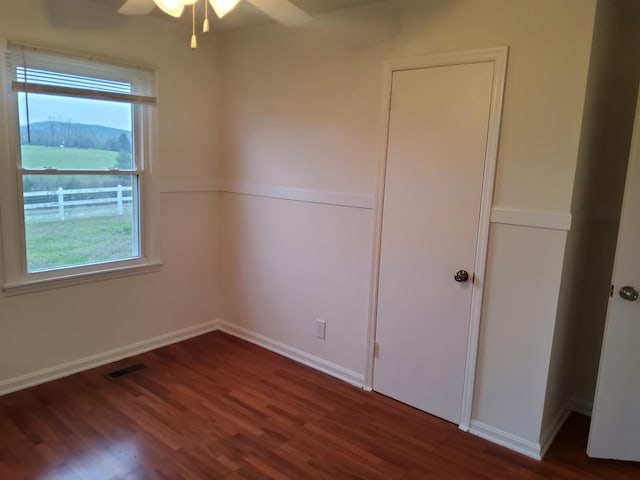 1833 Porterfield Rd, Readyville, TN 37149 - empty room with wood finished floors, a ceiling fan, visible vents, and plenty of natural light