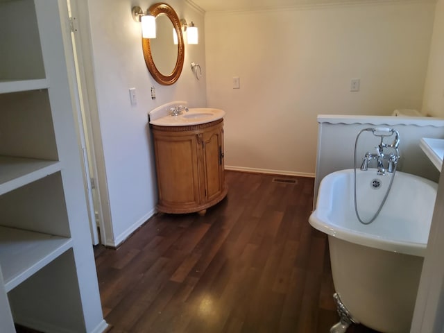 1833 Porterfield Rd, Readyville, TN 37149 - full bathroom with visible vents, baseboards, a freestanding bath, and wood finished floors