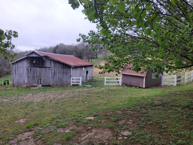 1833 Porterfield Rd, Readyville, TN 37149 - view of yard with an outbuilding and fence