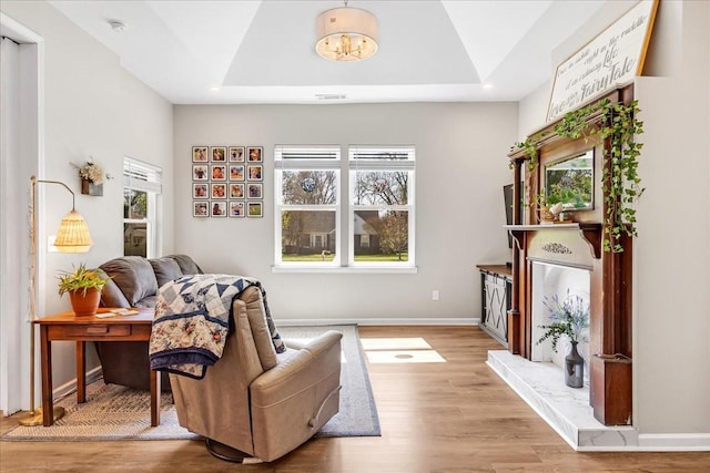 sitting room featuring visible vents, baseboards, a notable chandelier, recessed lighting, and wood finished floors