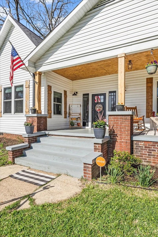 entrance to property with a porch
