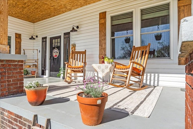 doorway to property featuring a porch