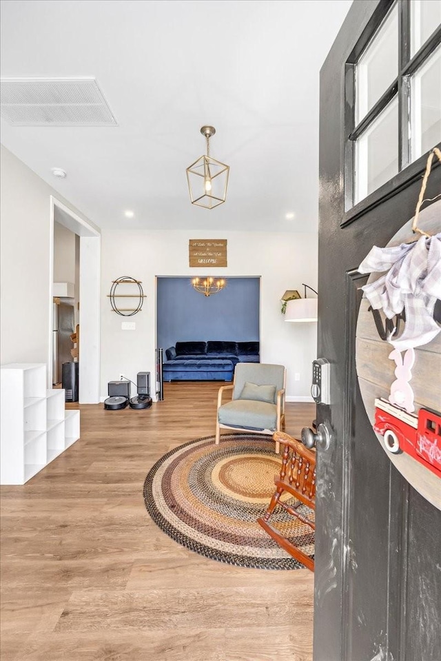 interior space featuring visible vents and wood finished floors